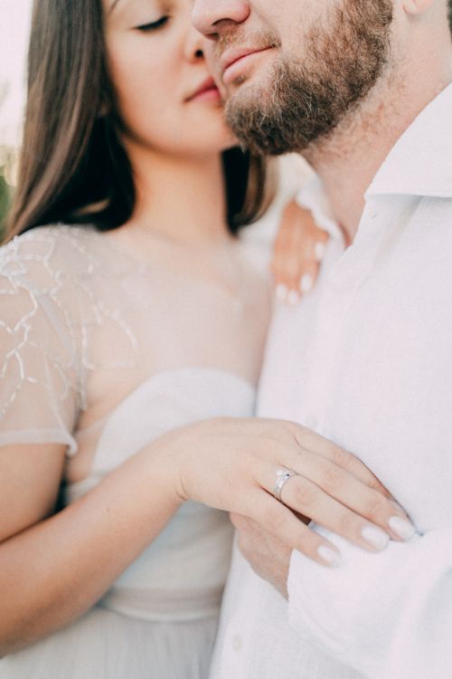 Free Intimate close-up of a bride and groom in wedding attire, showcasing love and tenderness. Stock Photo