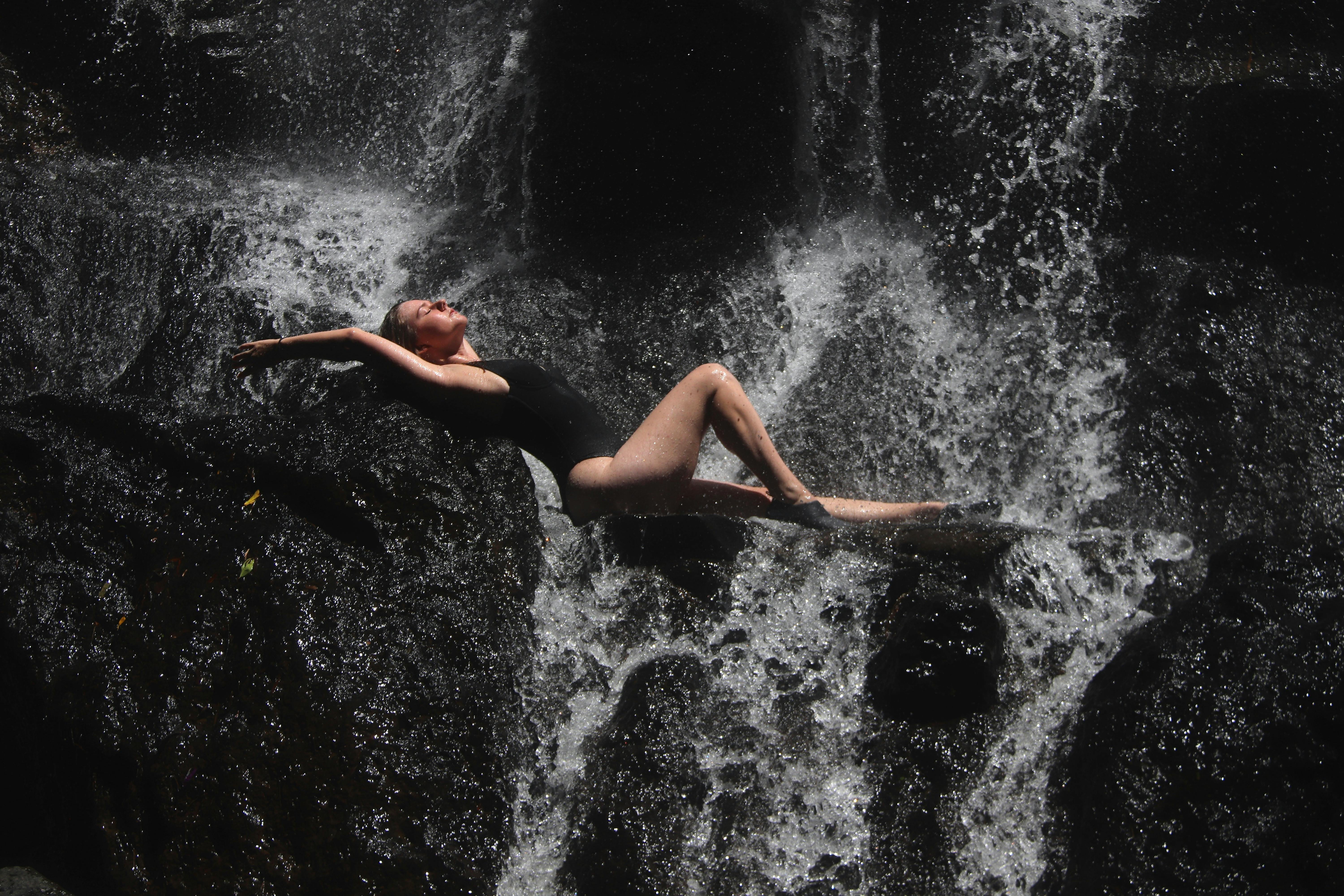 Slim Girl Poses on Round Rock against Waterfall, Nature Stock Footage ft.  backside & exercise - Envato Elements