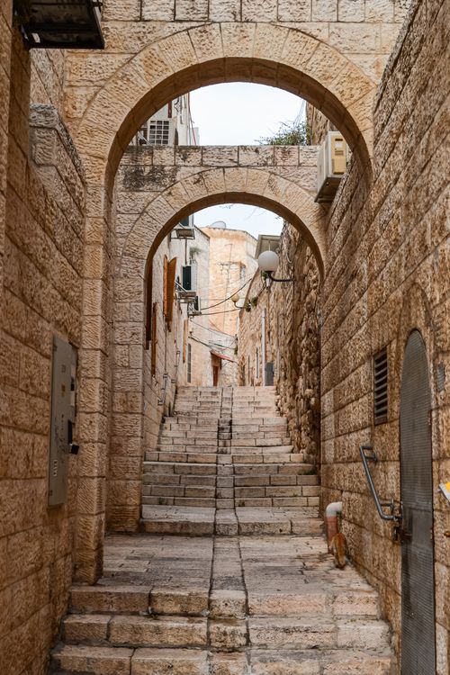 Free Explore the historic stone archway and steps in Jerusalem's Old Town, a glimpse into ancient urban architecture. Stock Photo