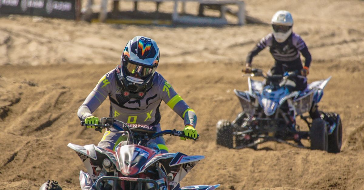 People Riding on Quad Bikes on the Beach at a Championship · Free Stock ...