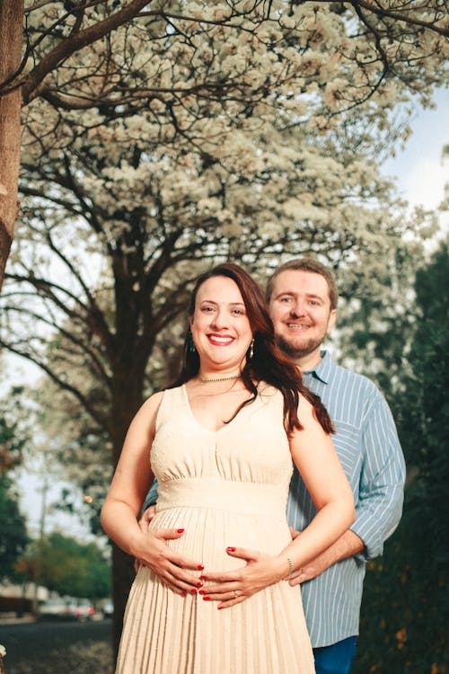 A Couple Doing a Pregnancy Photoshoot in a Park 