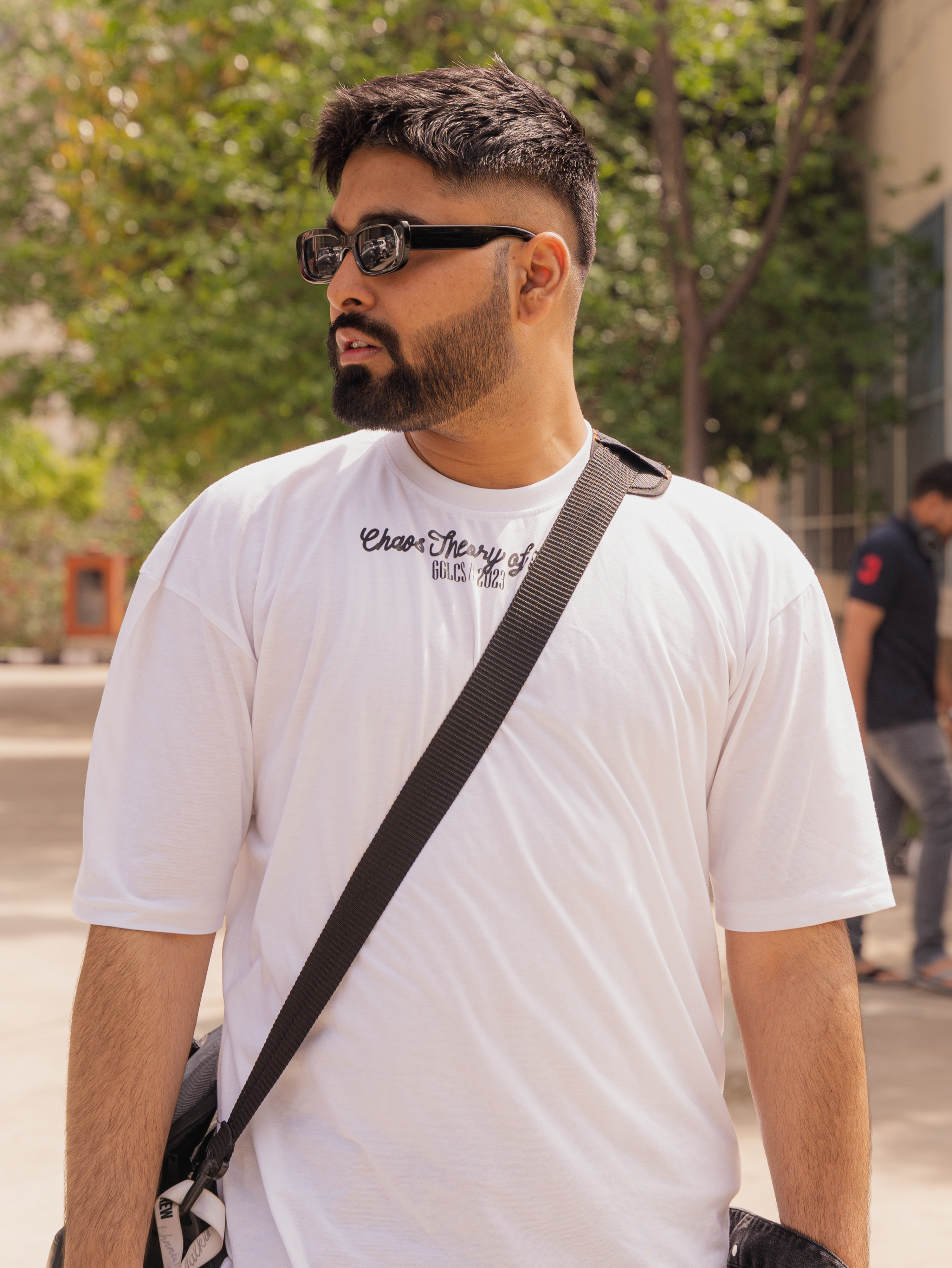 Portrait of a Man Wearing Sunglasses on a Square · Free Stock Photo