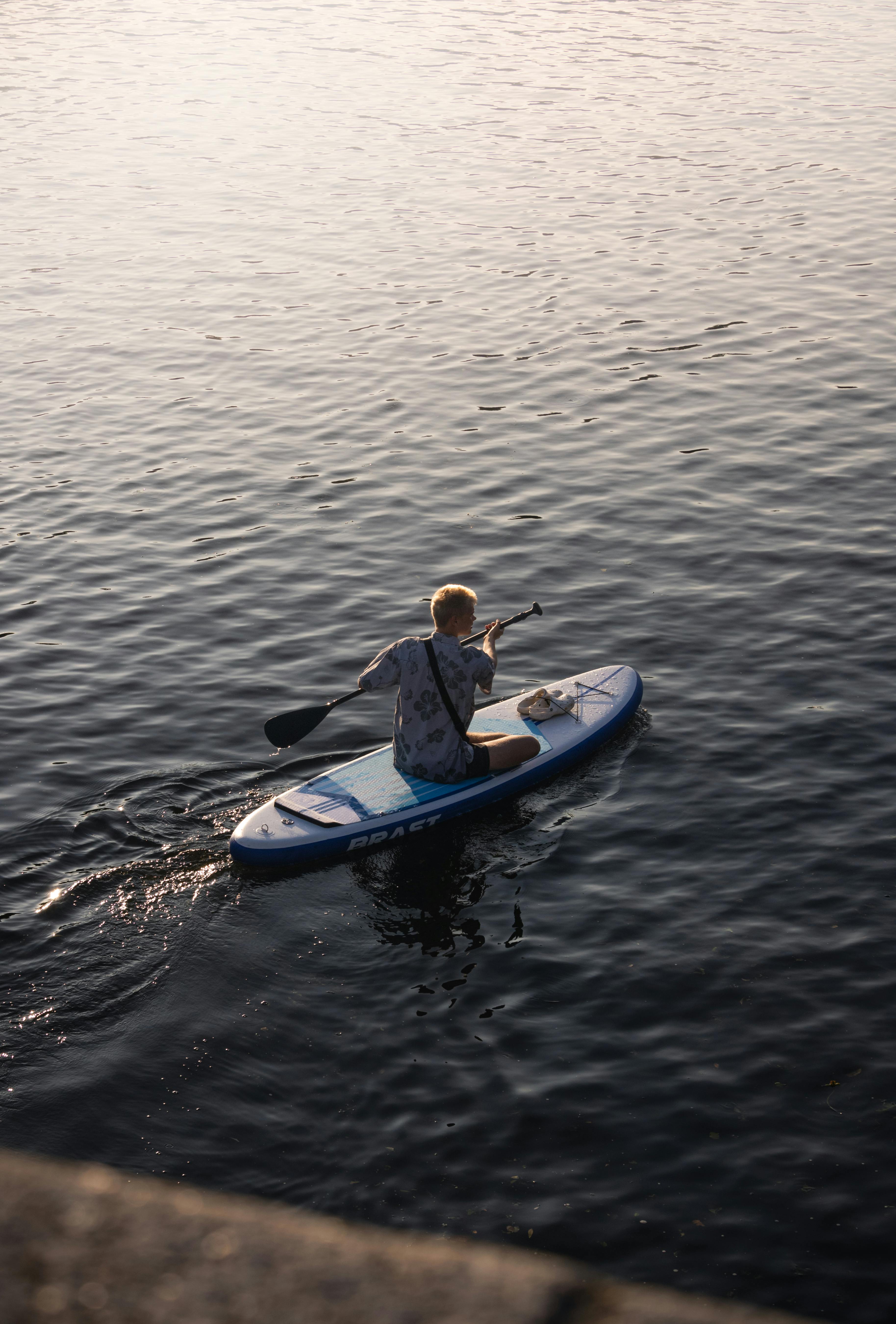 a person paddling on a paddle board in the water