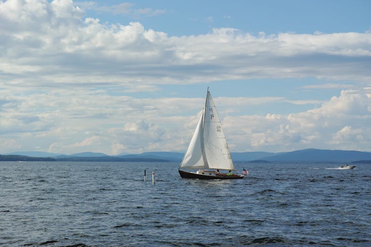 Sailboat With Flag Of USA In Sea