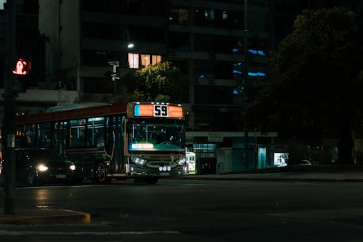 A night view of a bus and city street in Buenos Aires, Argentina.