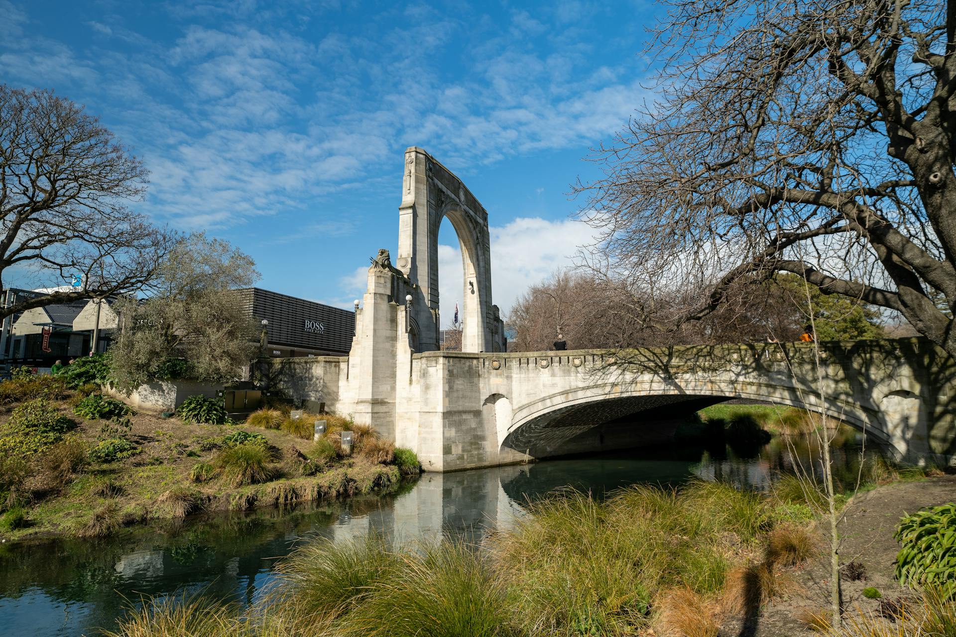 Scenic view of the Bridge of Remembrance in Christchurch, New Zealand, spanning the Avon River.