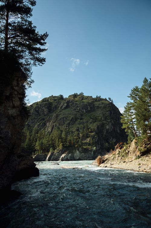 Free Breathtaking view of a river cutting through steep cliffs, showcasing nature's raw beauty. Stock Photo