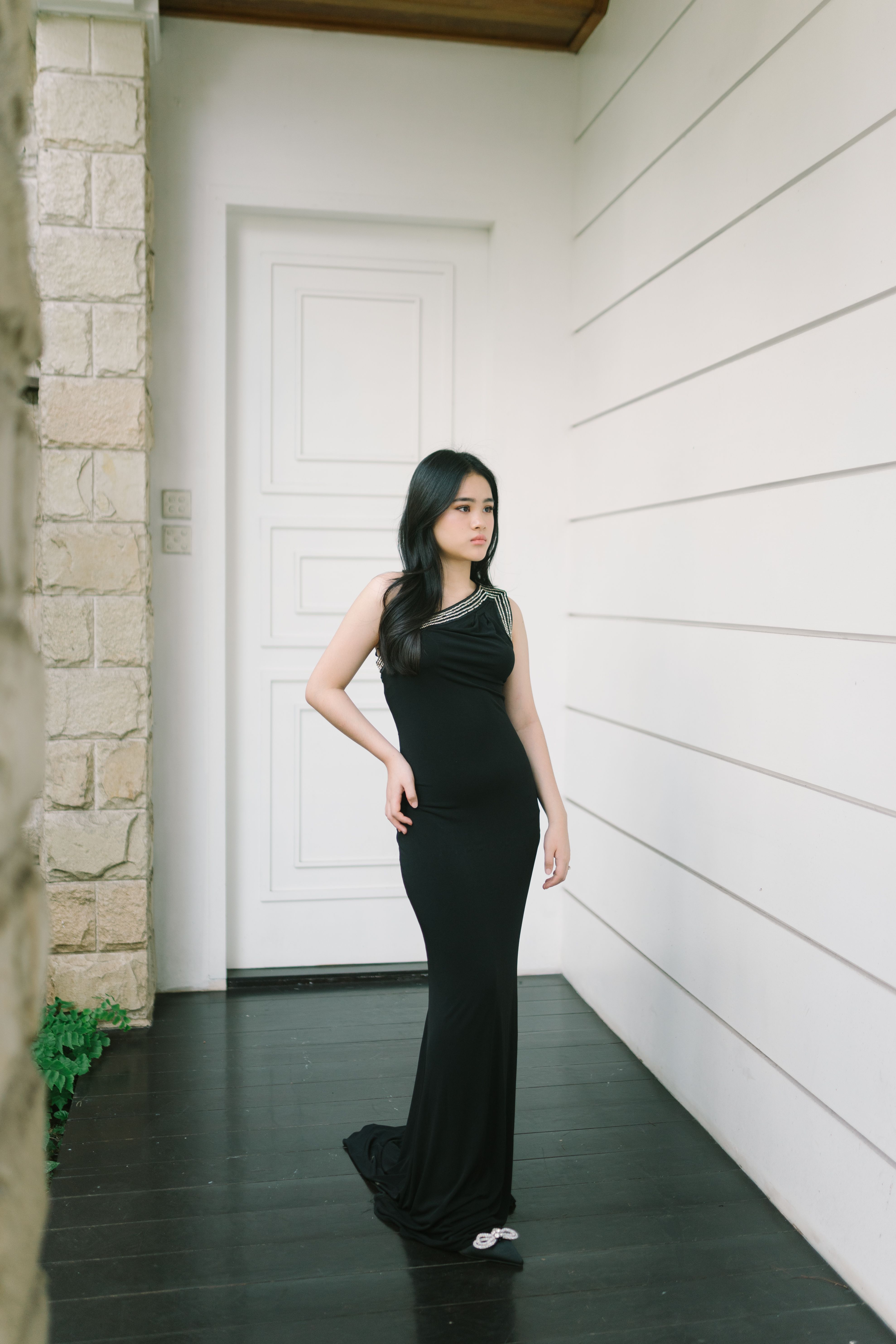 Young Woman in a Black Dress Standing in front of the House · Free ...