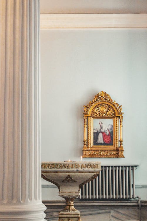 Column and Painting in Golden Frame behind