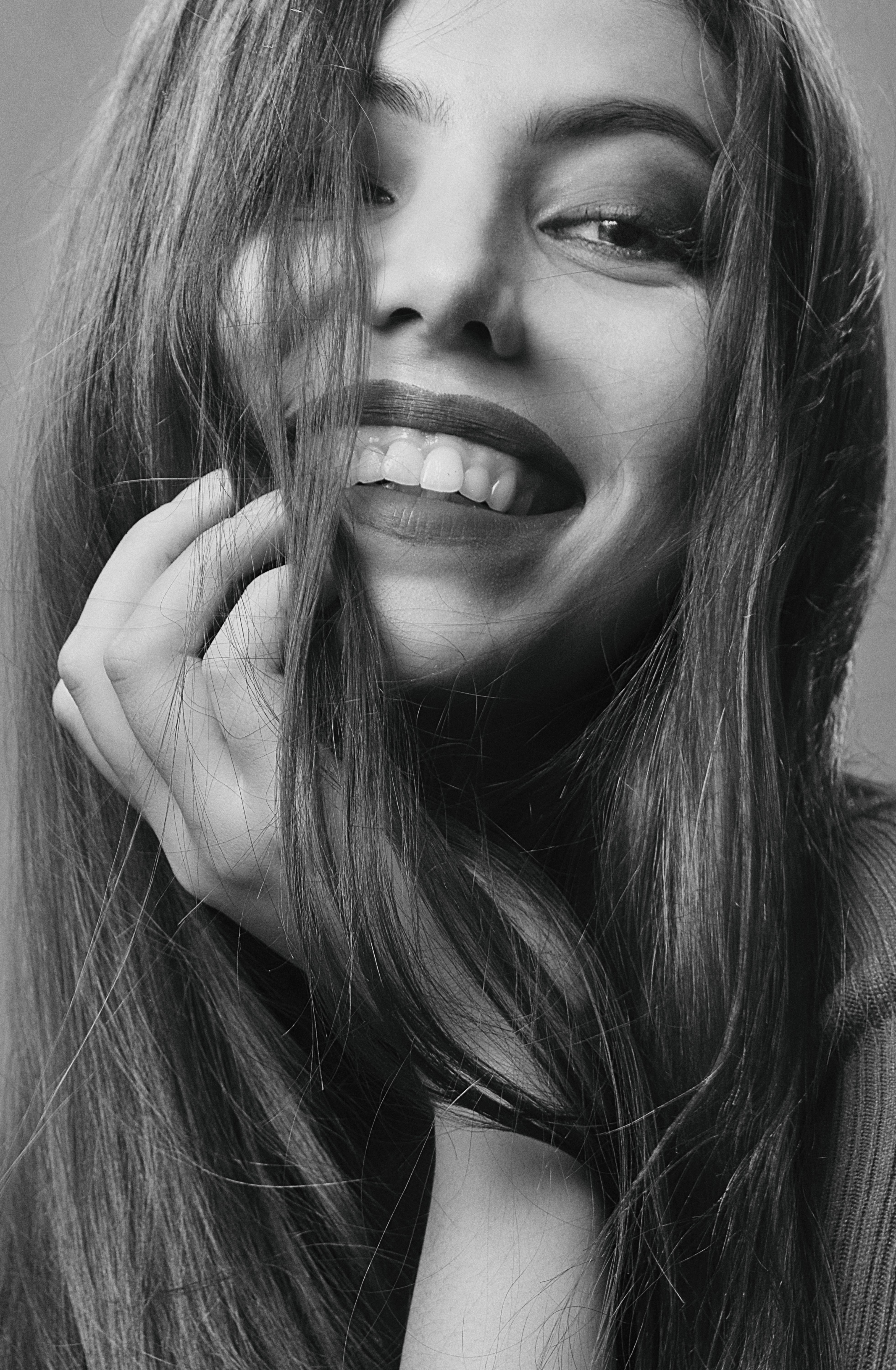 Smiling Woman with Hand on Chin · Free Stock Photo