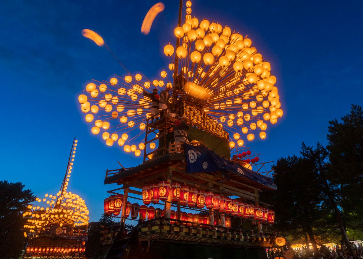 Illuminated traditional Japanese lanterns glowing at a night festival, like the Chichibu Yomatsuri winter festival