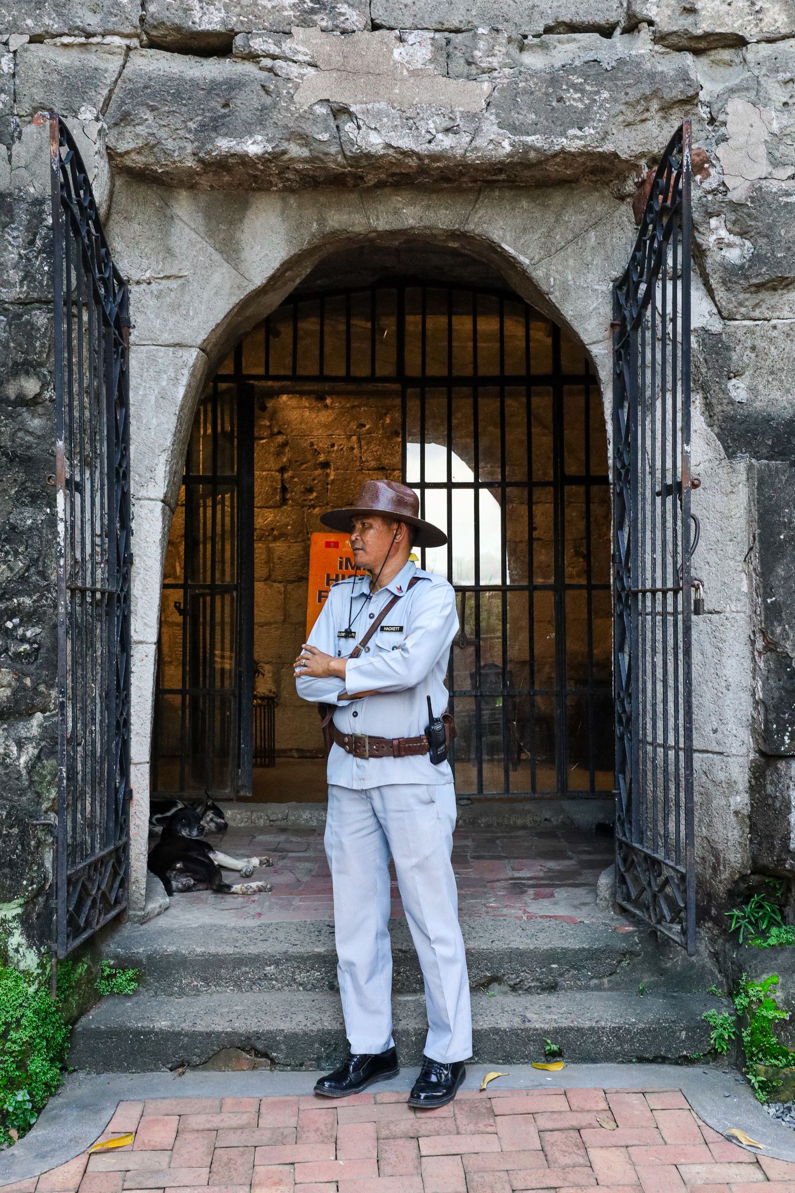 Security personnel standing guard at an entrance gate