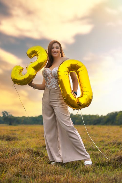 Smiling Woman with Birthday Balloons