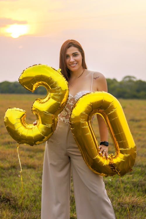 Smiling Woman with Birthday Balloons