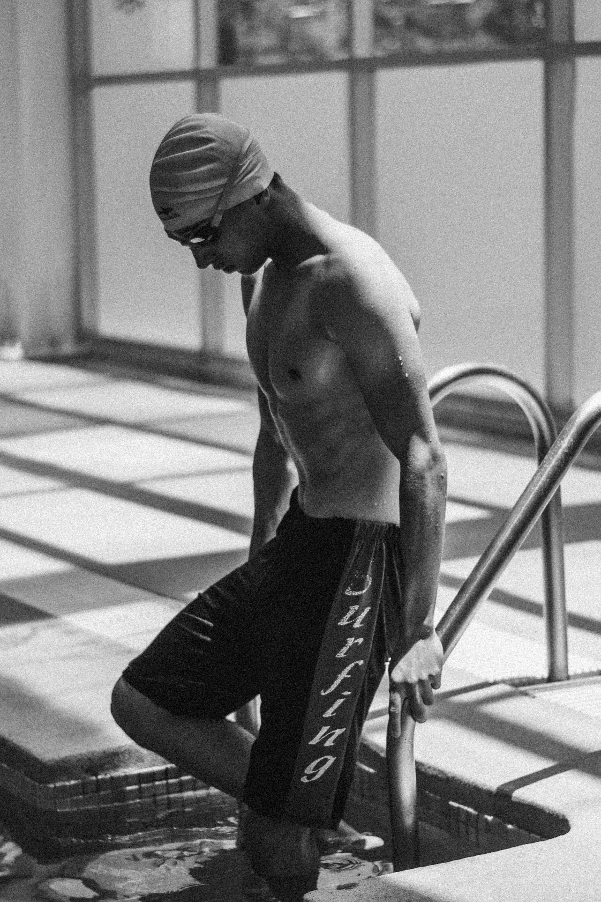 A Man Getting into a Swimming Pool · Free Stock Photo