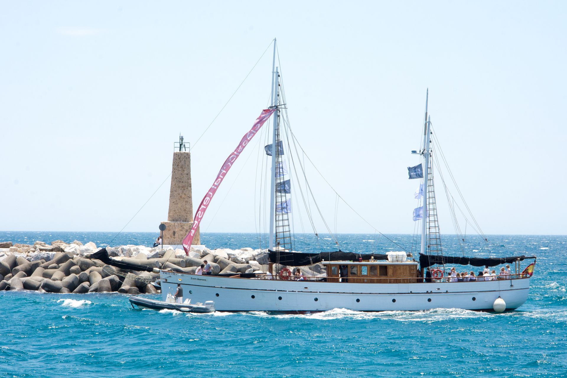Puerto Banús marina, Marbella — yachts and lighthouse under a clear blue sky — sample stock photo, replace with your own hero photo or video