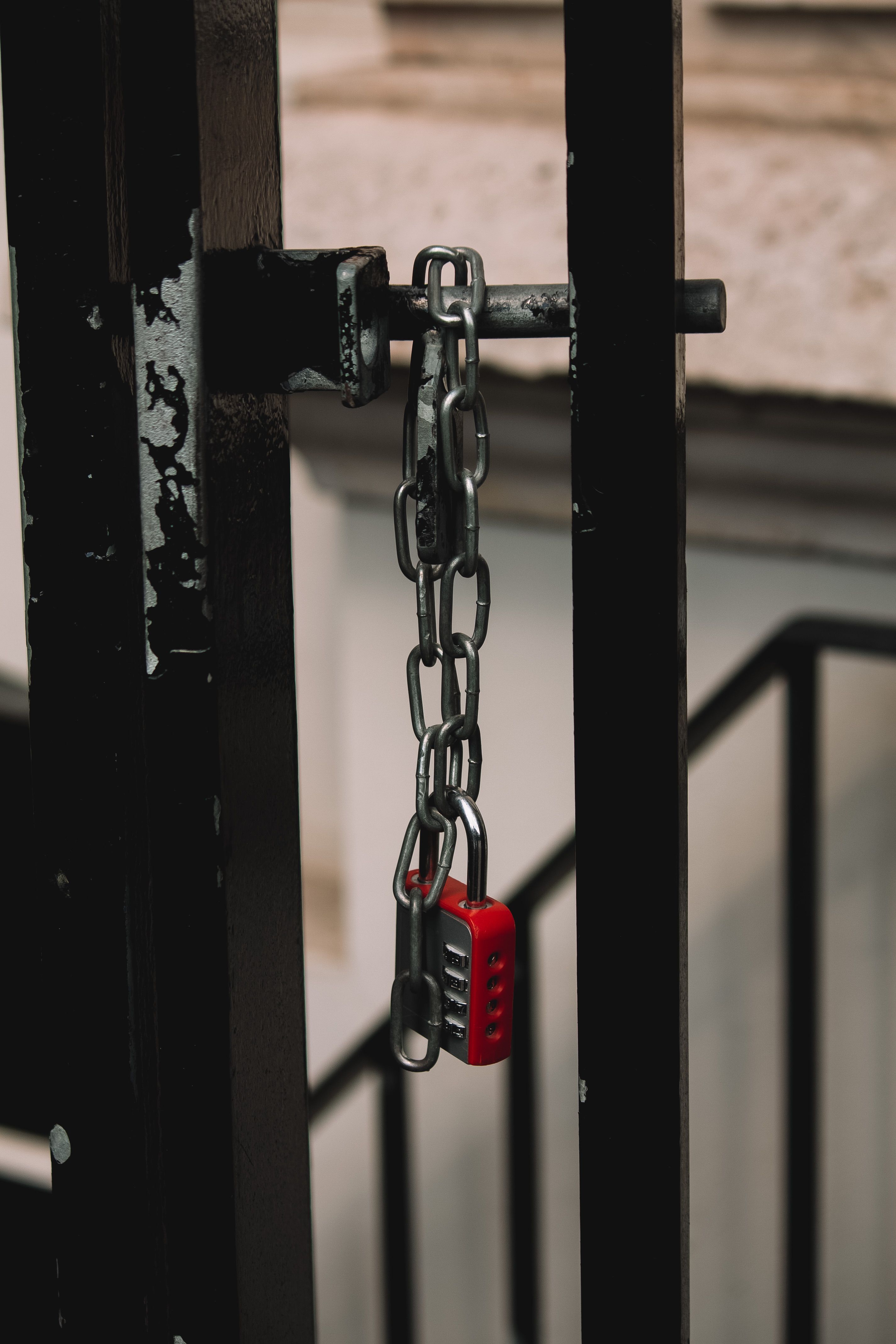 Combination Padlock Hanging on a Chain on the Gate · Free Stock Photo