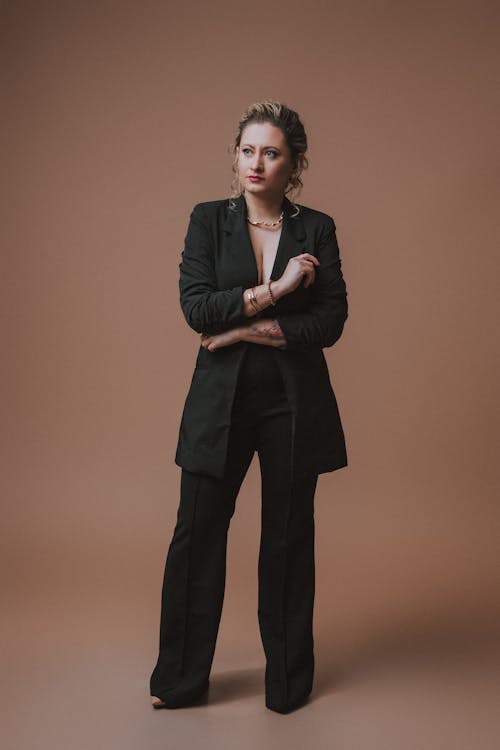 Model in Black Longline Blazer and Pants with a Crease
