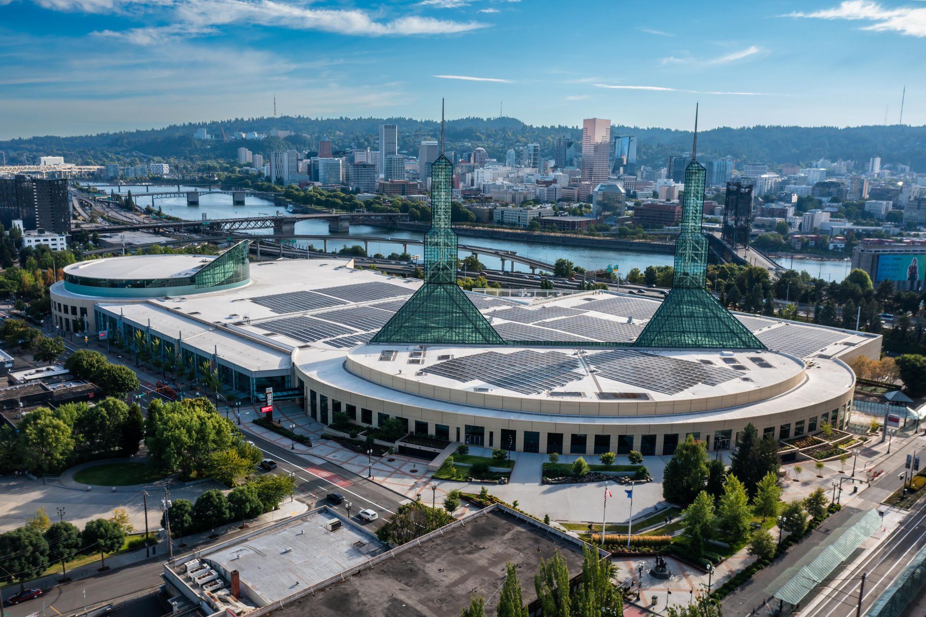 Stunning aerial view of the Oregon Convention Center with Portland skyline in the background.
