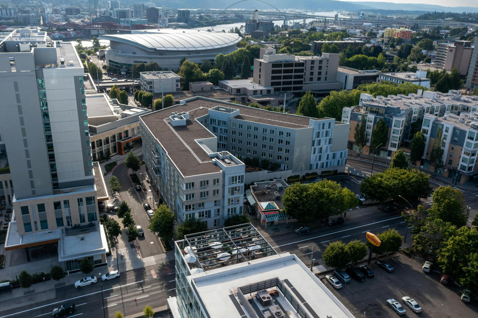 Aerial perspective of Portland's cityscape featuring Moda Center and urban architecture.