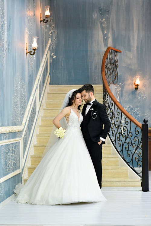 Bride and Groom Standing in an Elegant Building