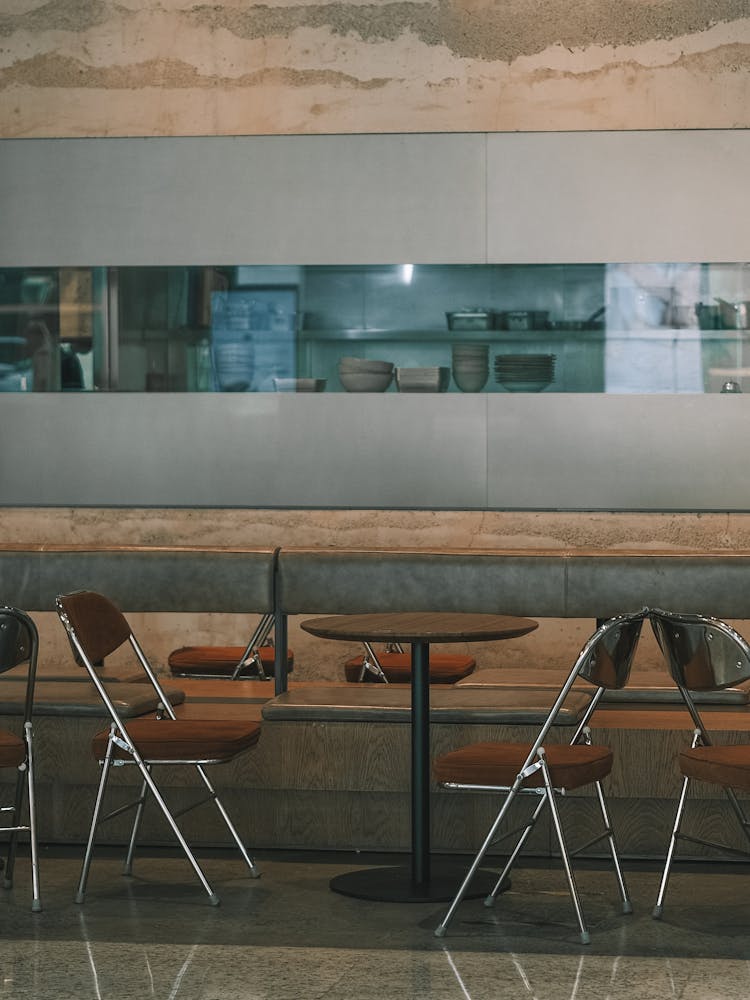 Empty Chairs And Table In Restaurant