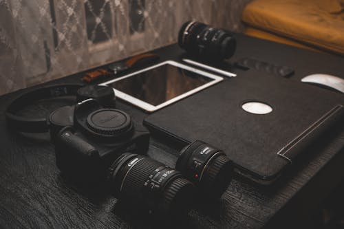 Black Canon Dslr Camera With Bag