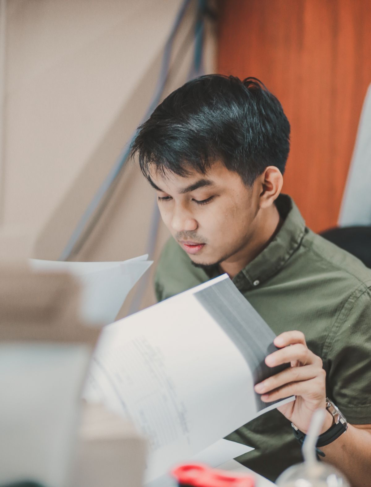 Engineer reading project documents intently at a desk