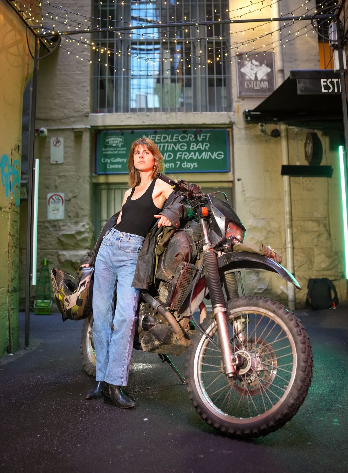 A Woman Posing with a Motorcycle · Free Stock Photo