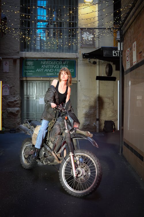 Woman in Jacket Posing on Motorbike