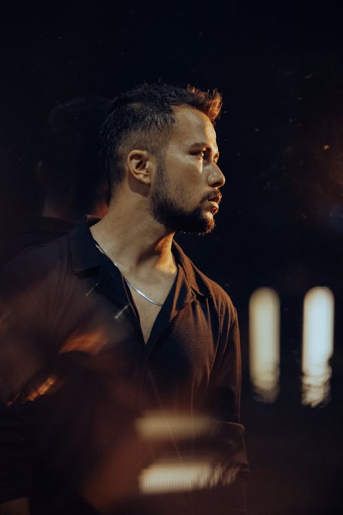 A Man with a Stubble in a Black Shirt 