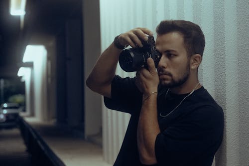 Photographer Taking Pictures with Camera