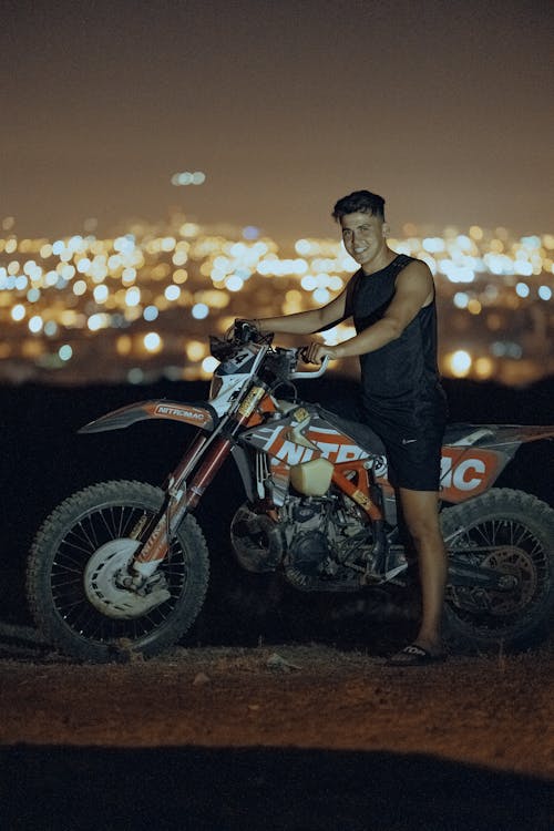 Young Man Posing on a Motorcycle 