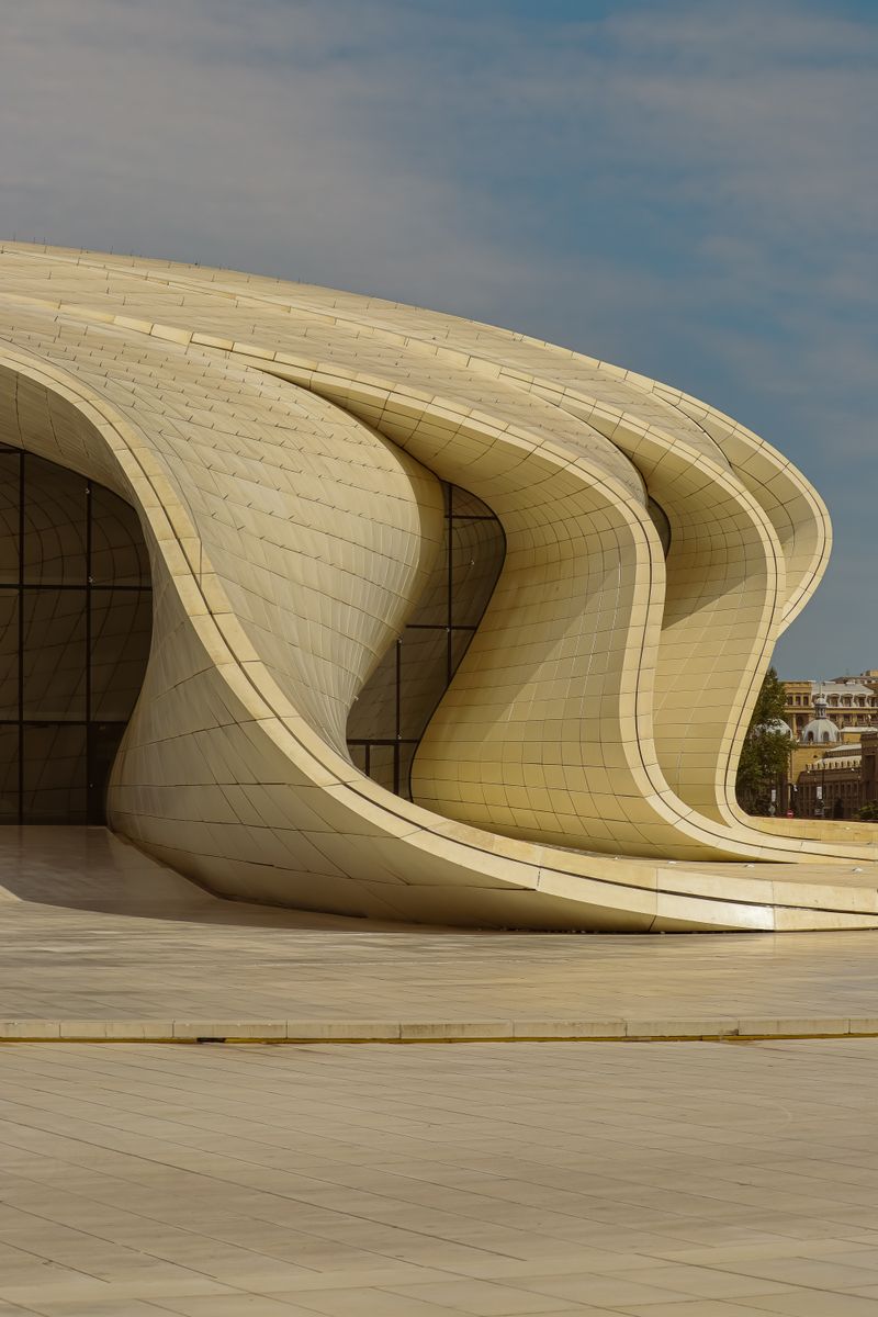 Curved white facade of the Heydar Aliyev Center in Baku