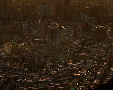 Stunning dusk aerial view of Taipei, Taiwan's vibrant urban landscape.