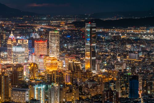 Free Stunning aerial view of Taipei's illuminated skyscrapers at night, showcasing modern architecture. Stock Photo