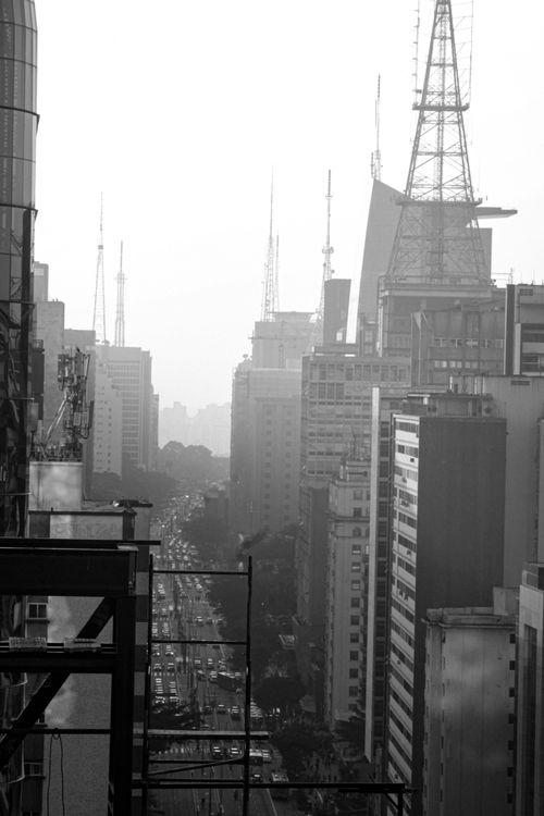 Free Black and white photograph of a city skyline with modern architecture and busy streets. Stock Photo