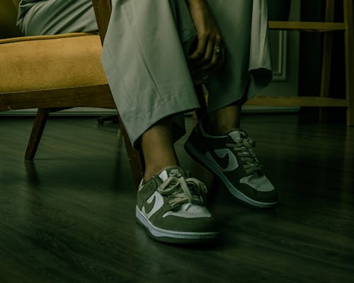 Model in Nike Sneakers Sitting on a Armchair