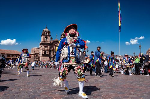 Free Colorful dancers in traditional costumes celebrate a lively festival in the historic city of Cusco, Peru. Stock Photo