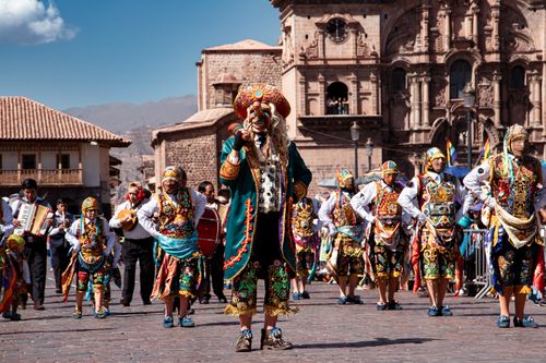 Free Colorful dancers in traditional costumes parade through Cusco, showcasing rich cultural heritage. Stock Photo