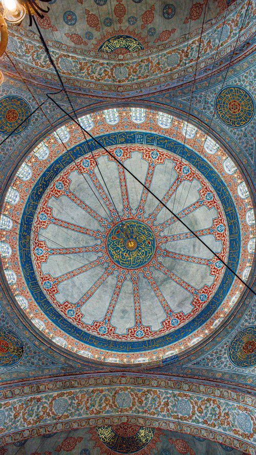 Free Detailed artwork of the dome in the Blue Mosque, capturing intricate Islamic designs in Istanbul. Stock Photo