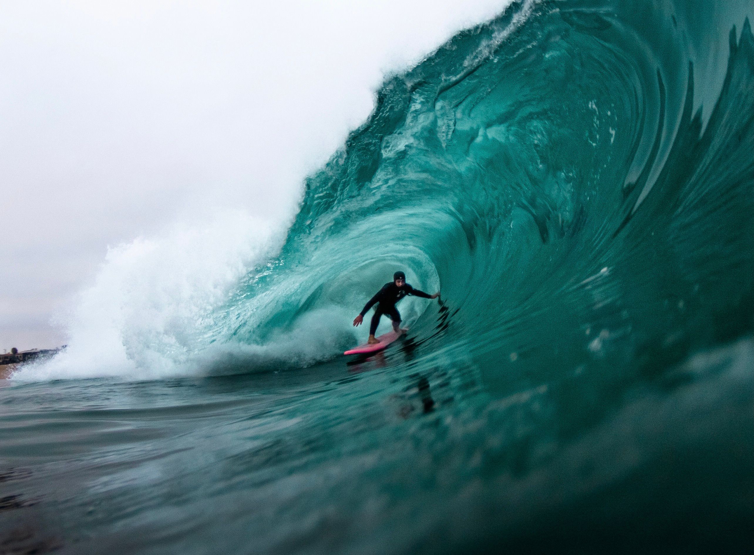 Surfer skillfully riding a powerful wave in the open ocean