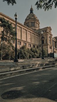 The Palau Nacional's stunning dome in Barcelona against a tranquil backdrop, ideal for travel and architecture enthusiasts.