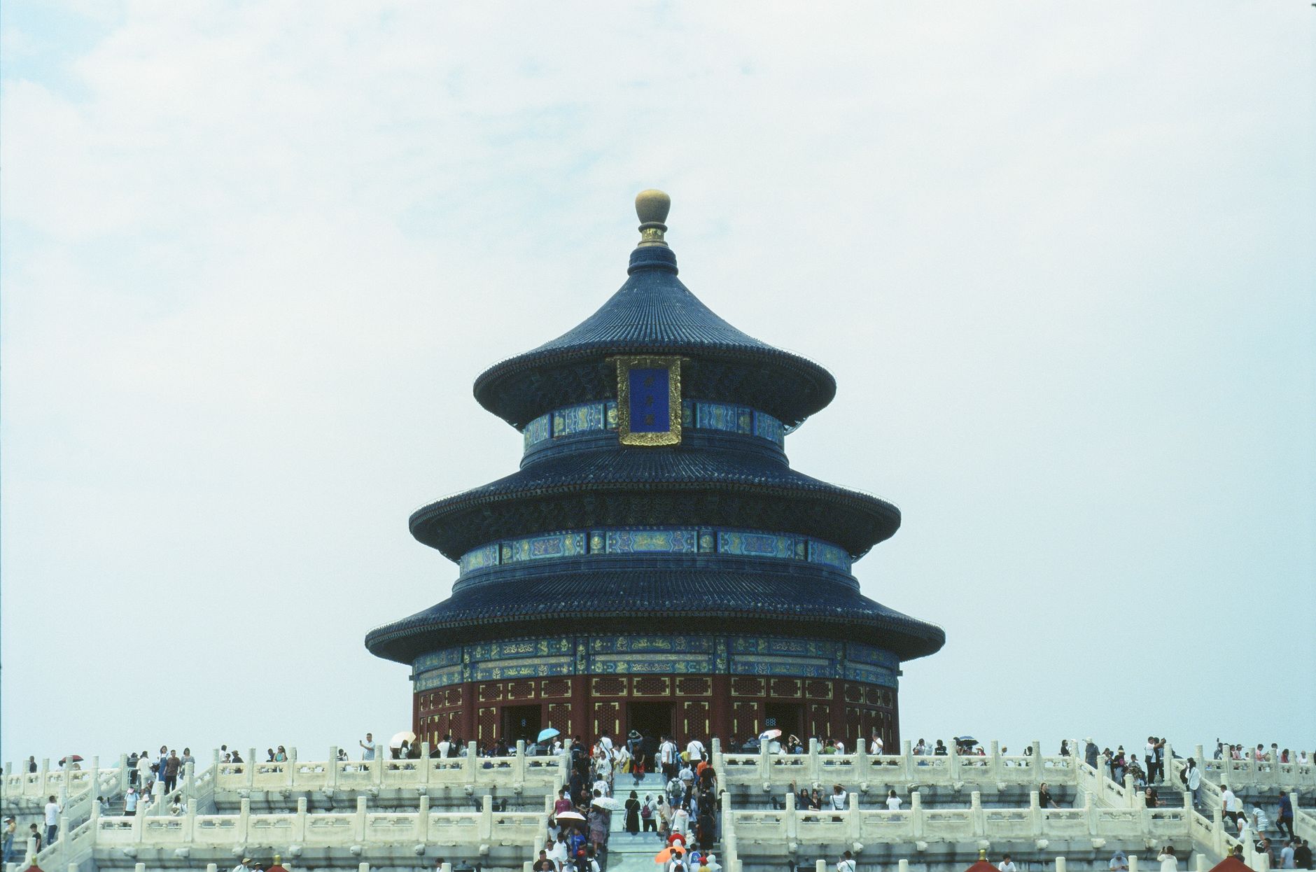 The iconic Temple of Heaven in Beijing, a renowned UNESCO World Heritage site, with visiting tourists.
