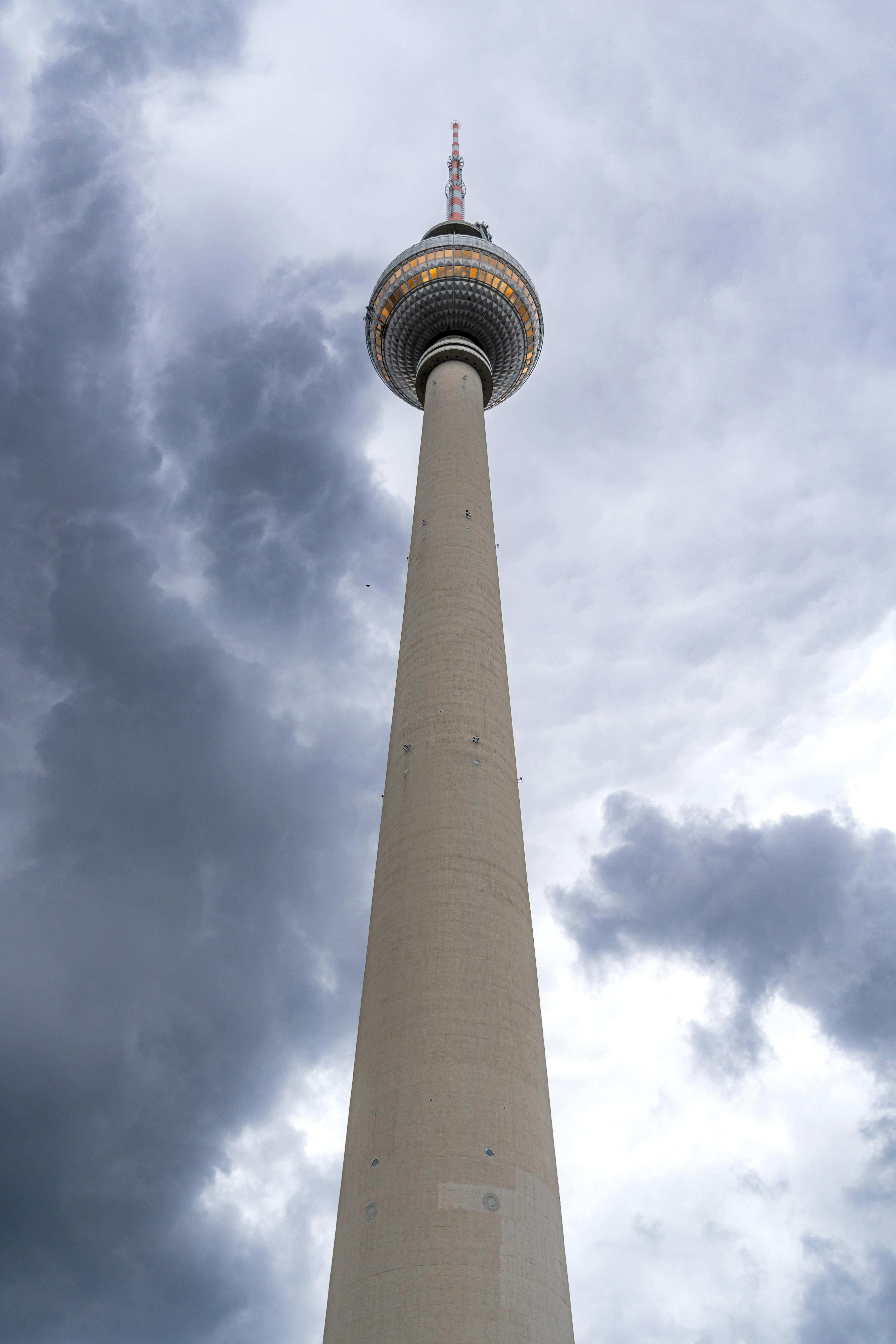 berlin tv tower against dramatic cloudy sky