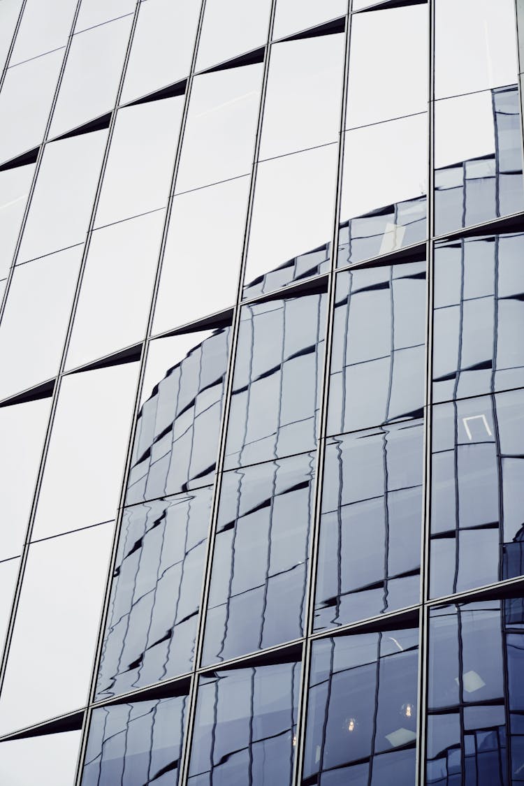 Building Reflecting In Glass Wall