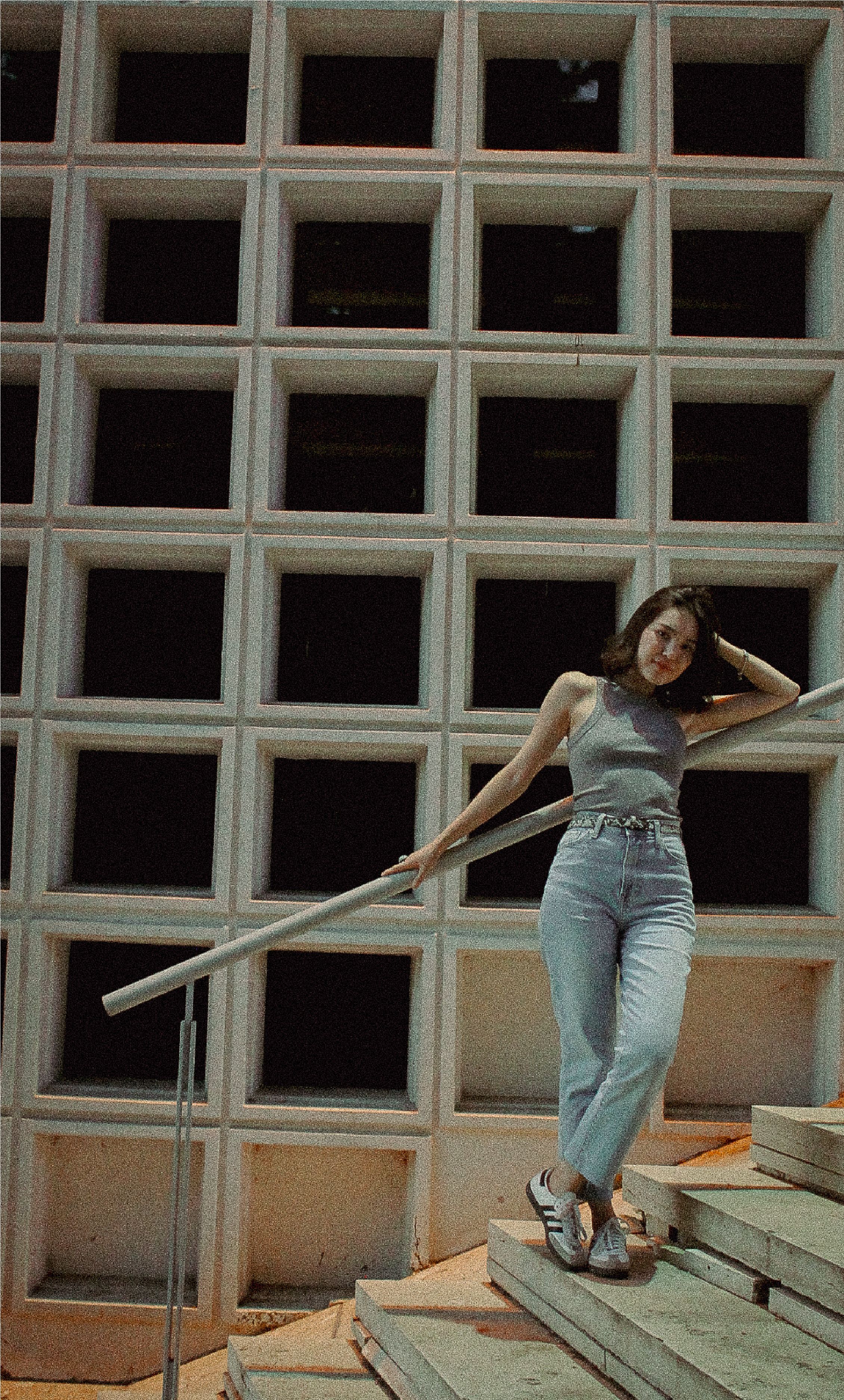 Girl Posing against a Concrete Structure · Free Stock Photo
