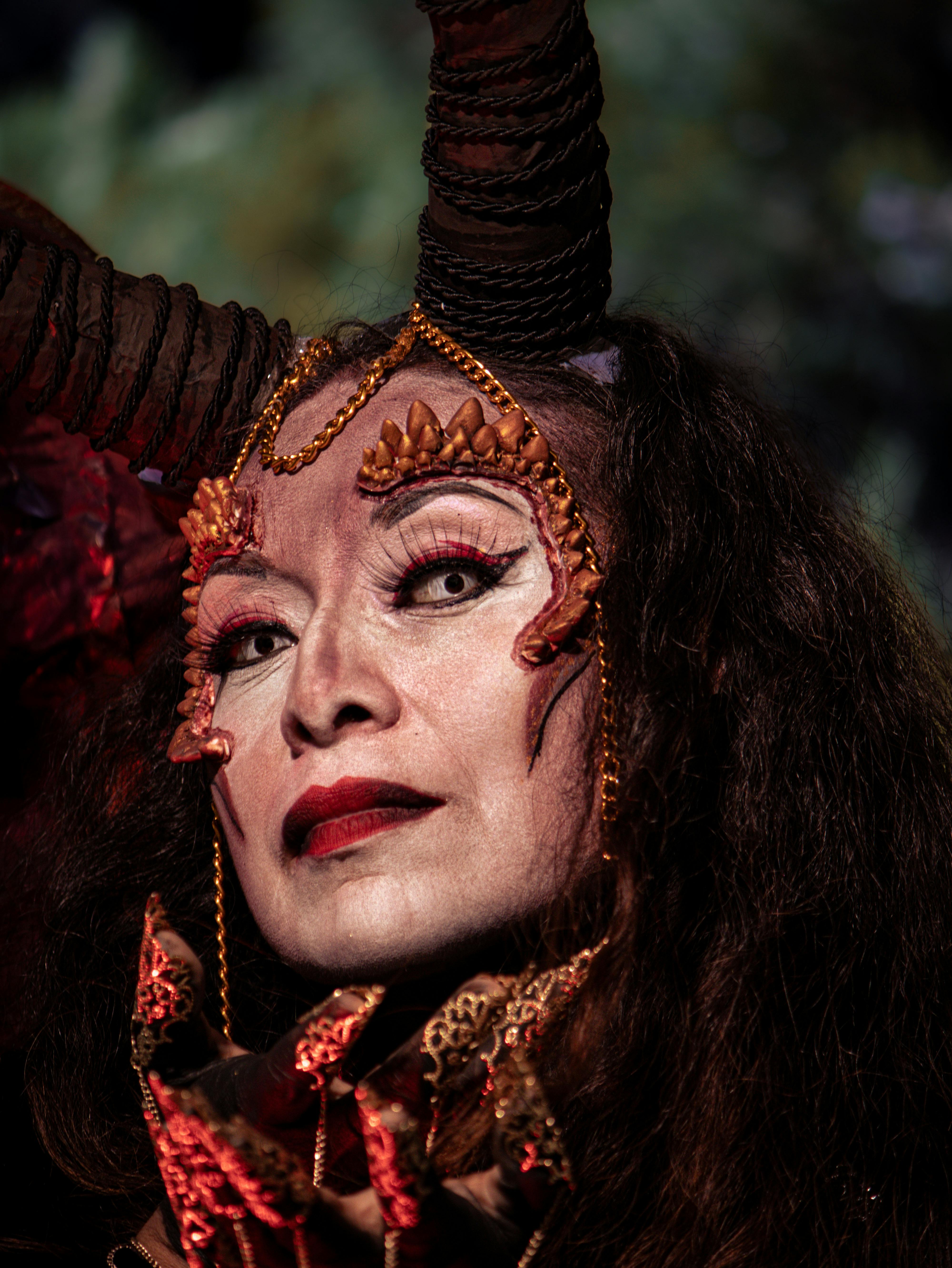 closeup of a woman wearing a dark demonic costume