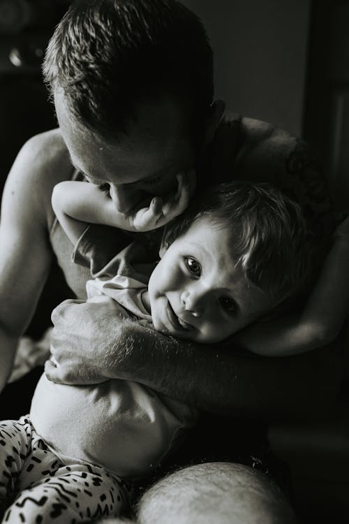 Free Black and White Photo of a Man with a Son Stock Photo