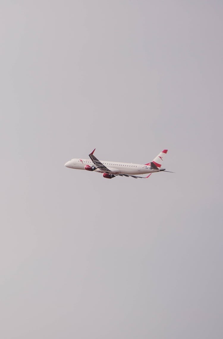 Airplane Flying On Sky